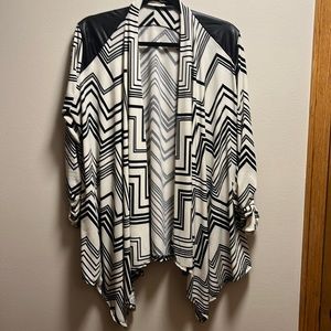 Black and white patterned, handkerchief style cardigan with faux leather detail